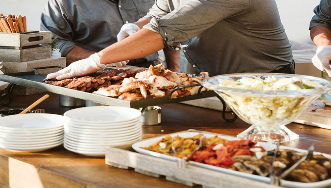 Serving The Asado Presentation And Accompanying Dishes