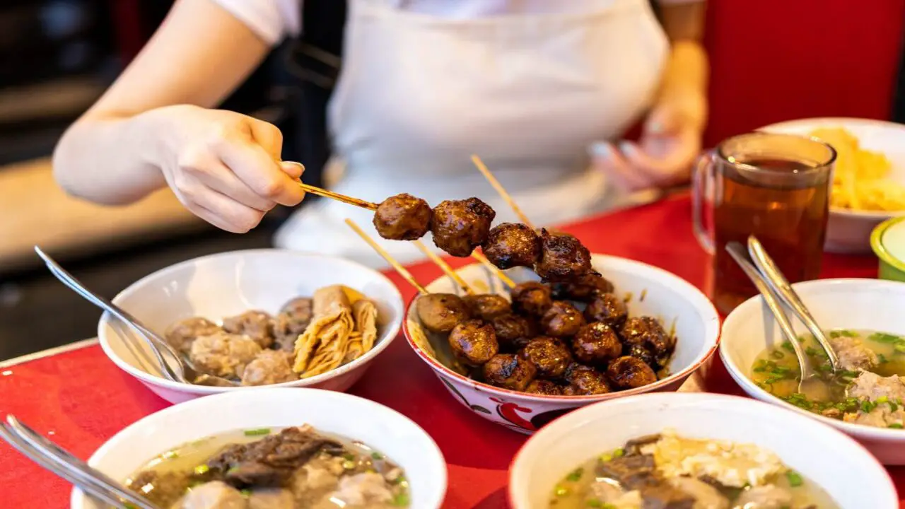 Serving And Enjoying The Fried-Bakso