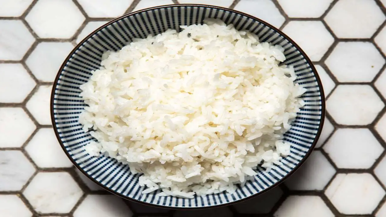 Testing The Texture And Doneness Of The Rice